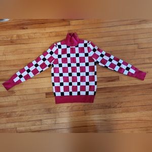 Pink, black and white checkered sweater